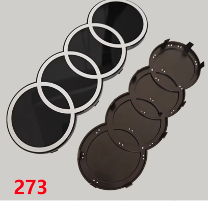 Original supplier front and rear mounting views of 2D-style front grille ring emblem, 273 mm width